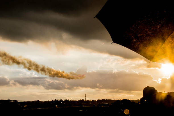 Leopoldsburg, Belgium, - September 10, 2022. People watching an airshow in the middle of a rain shower.
