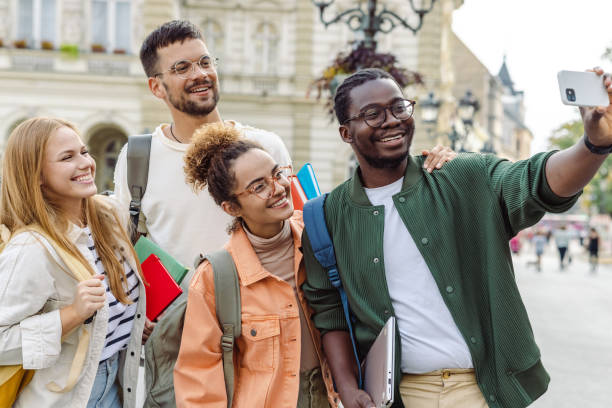 istock Young man is taking a selfie with his university friends 1423061819