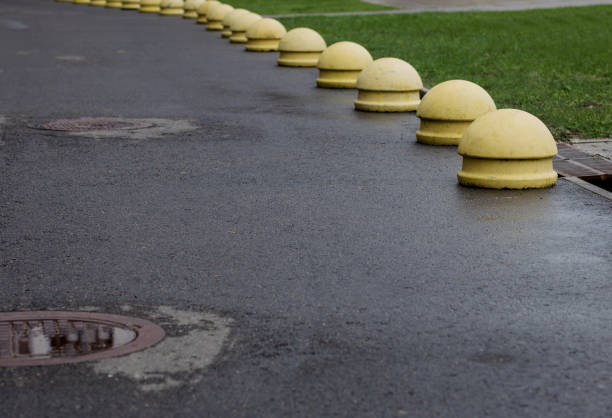 istock concrete balls attached to the paving or asphalt. 1423063111