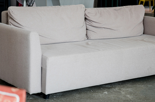 A modern suede sofa in a contemporary family room.