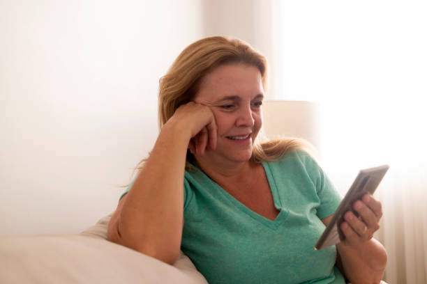 istock Brazilian woman looking at  an eletronic device. 1423068743
