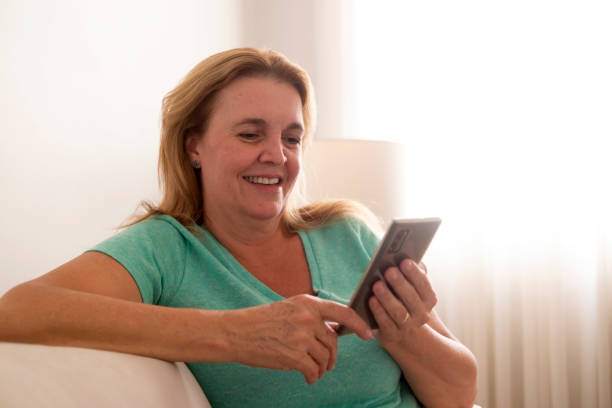 istock Brazilian woman looking at  an eletronic device. 1423070499