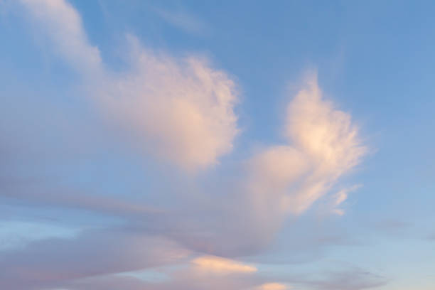 istock Pink sunset clouds and blue sky weather 1423070836