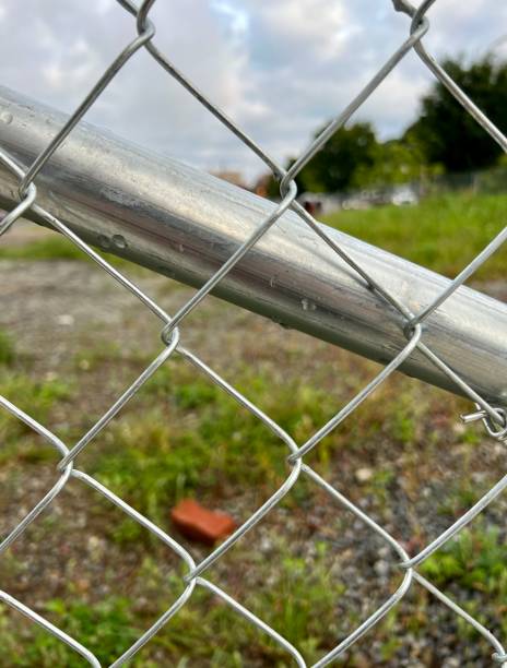 istock Chain Link Fence Around Vacant Lot 1423071226