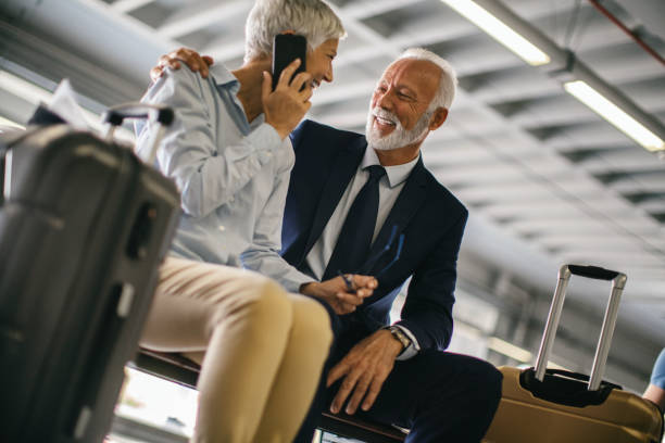 istock Business couple waiting for a train. 1423072212