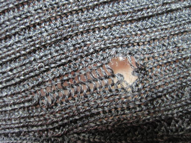 istock Sweater with holes eaten by insects 1423073314