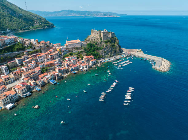 Aerial view of Scilla, Reggio Calabria, Calabria. Italy. Ruffo Castle and lighthouse. Aerial view of Scilla, Reggio Calabria, Calabria. Promontory at the northern entrance of the Strait of Messina. Ruffo Castle and lighthouse. Tyrrhenian Sea. Italy castle scilla stock pictures, royalty-free photos & images