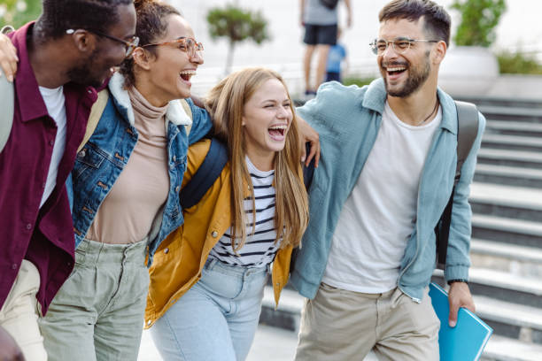 istock Cheerful Multi-ethnic group of students on the street 1423074534