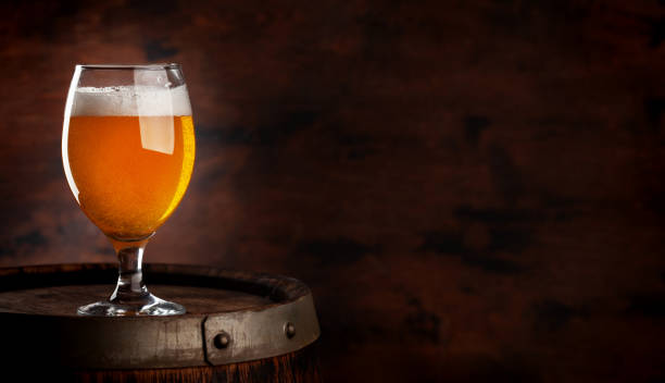 istock Beer glass on wooden barrel 1423078529