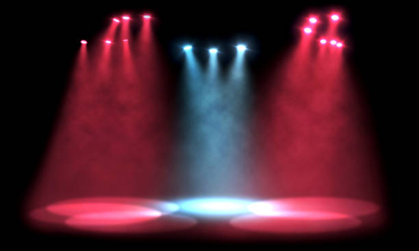 istock Group of red and blue spotlights casting light on empty stage 1423081075