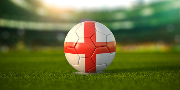 Football ball with flag of England on the field of football stadium and space for name of football clubs. Football championship of England concept. 3d illustration