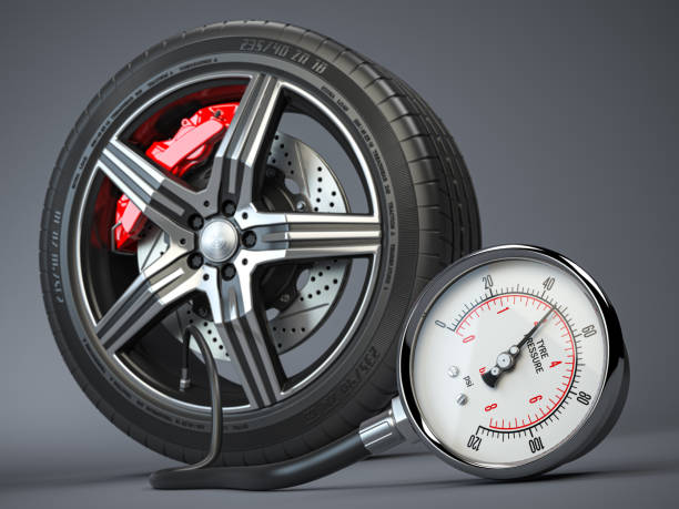 tyre pressure gauge and car wheel. inflation, inspection and measurement of wheel tyre. - inflating imagens e fotografias de stock