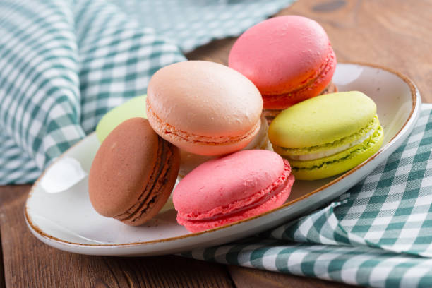 istock Colorful macaroon cookies on white plate close up 1423086046