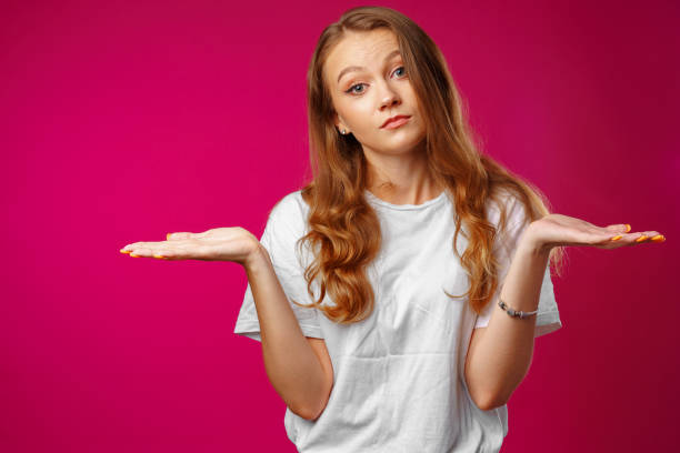 istock Young caucasian girl making do not know sign 1423086228