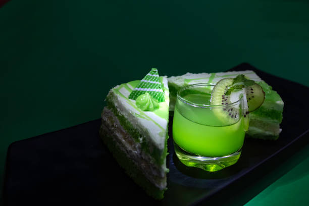 istock Dessert. pastry, mango drink, green grapes on dark background. bright. macro. close up 1423089455