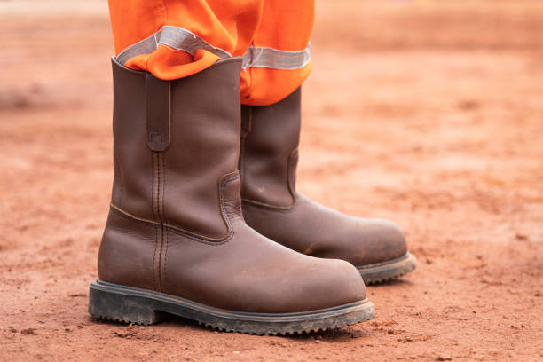 istock A construction with safety shoe standing on dirt ground. 1423091587