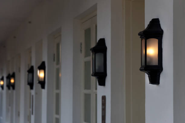 istock row of vintage lamps light on wall 1423093670