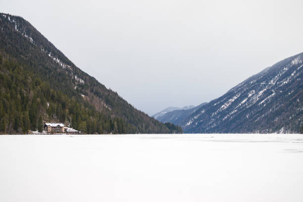 istock Lake Weissensee on a cold day in winter 1423104768