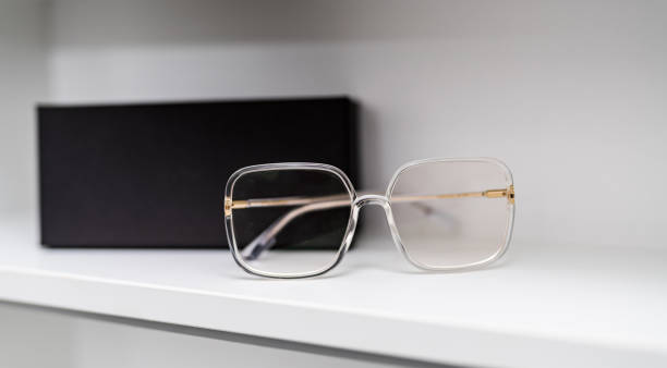 istock Eyewear modern accessory. Woman hand holding sunglasses. 1423111590