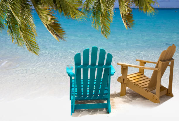 istock Two beach chairs on white sand Caribbean coast 1423118378