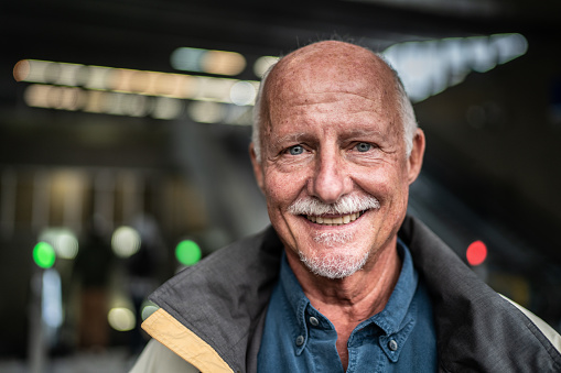 Portrait of a senior man in a subway station