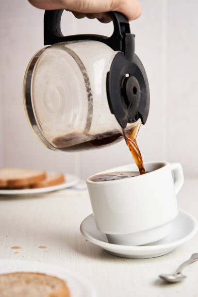 istock Pouring and spilling coffee on a white background 1423119082