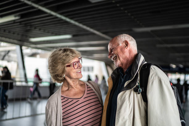 istock Senior couple talking in a subway station 1423119936