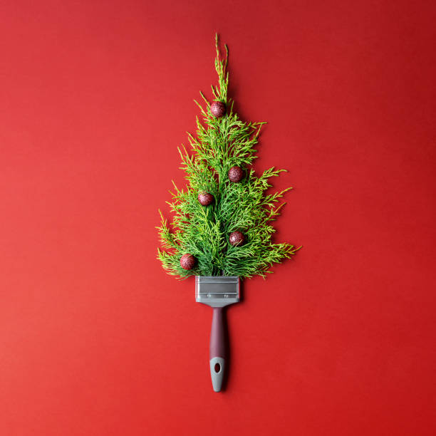 istock Creative Christmas tree on red paper background with copy space. 1423122416