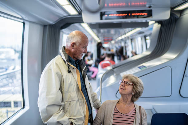 istock Senior couple talking in the subway train 1423124297