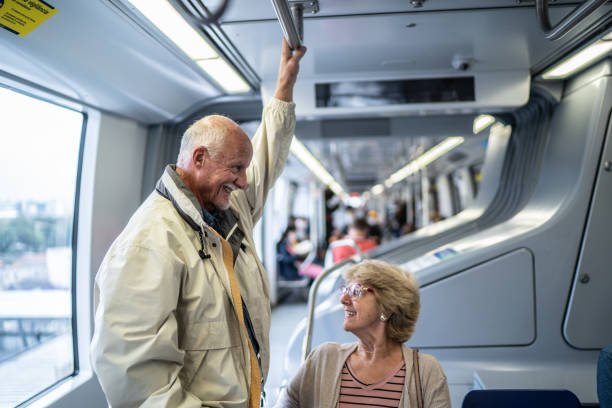 istock Senior couple talking in the subway train 1423124341