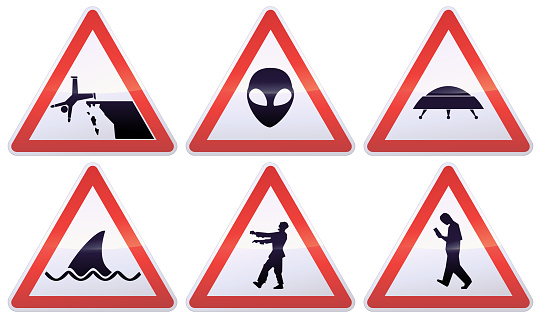 Collection of white, black and red triangular warning signs of atypical dangers, such as falling off a cliff, aliens, flying saucers, shark attacks, zombies and smombies