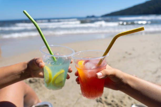 istock Friends are cheering on the beach 1423134561