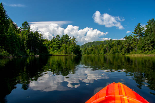 Clear lake reflects clouds and blue sky