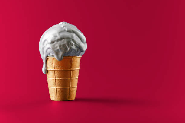 istock Melting metallic ice cream in a gold cup on a red background. Creative concept for a premium sale. 1423138749