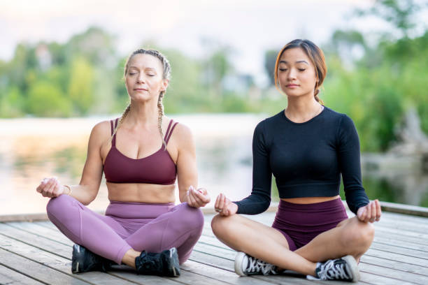 istock Women's Lakeside Meditation 1423138815