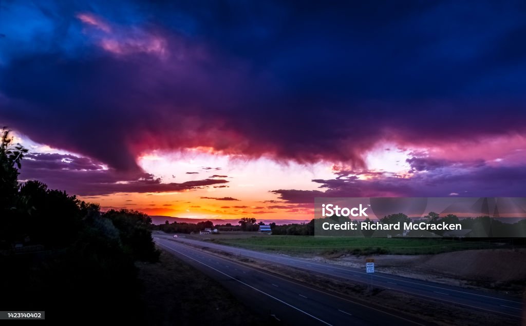Beautiful sunset near Grand Junction, Colorado and Interstate I70 Colorado with a farm and ranch in background. Agriculture Stock Photo