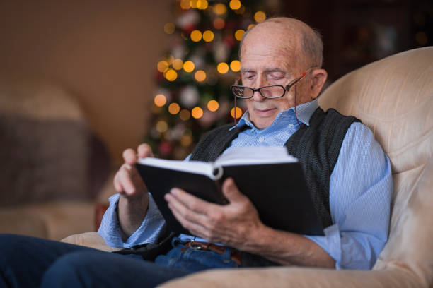 istock Senior man relaxing with a good book 1423140452
