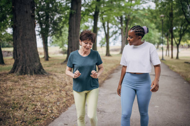 istock Two women in park 1423144079