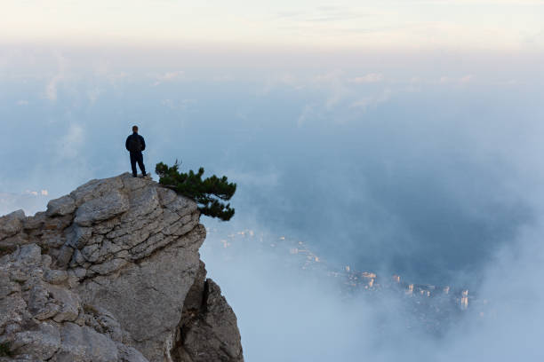 istock Traveler. A man in the mountains. 1423147738