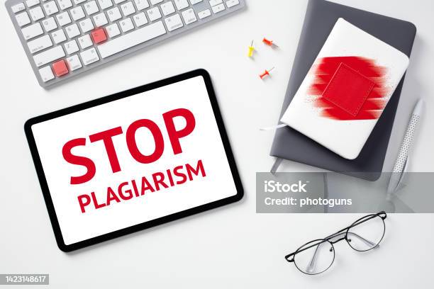 Stop Plagiarism Concept Flat Lay Digital Tablet With Text Stop Plagiarism On Screen Keyboard With Lighted Keys Control C Paper Notebooks Glasses On White Desk Stock Photo - Download Image Now