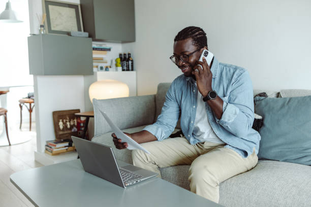 istock Young man working from home and taking care of paperwork 1423149951