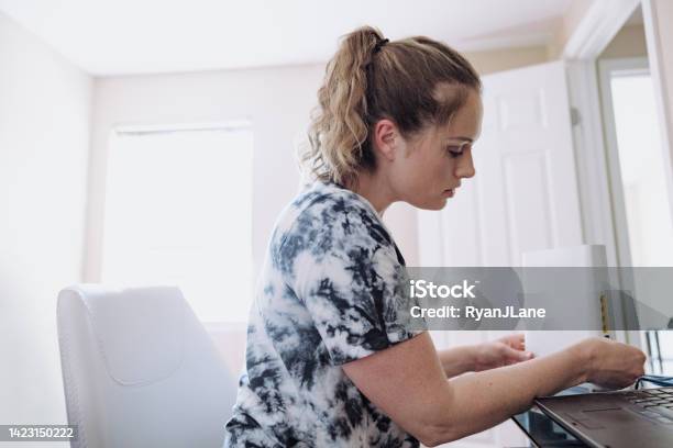 Woman Connecting Router In Home Office Stock Photo - Download Image Now - Router, Domestic Life, Internet