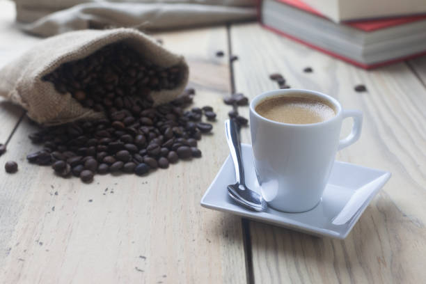 istock Cup of coffee on the table next to some books 1423150716