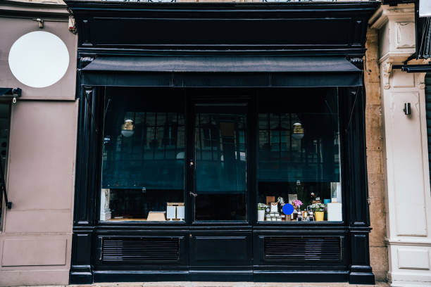 istock Store with black door in old building 1423151849