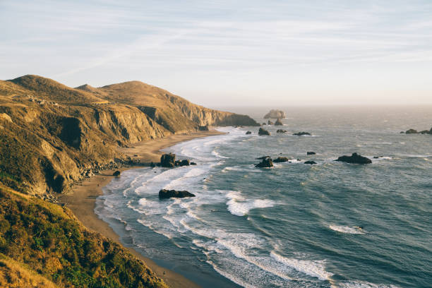 istock Stormy sea near cliff in sunlight 1423151896