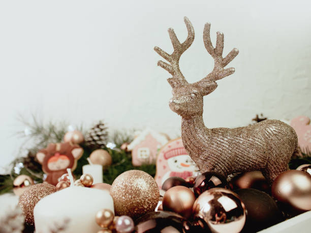 bright christmas background with gold reindeer on light background - reindeer christmas decoration gold photography imagens e fotografias de stock
