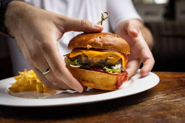 istock delicious burger with chicken, cheese and lettuce 1423154033