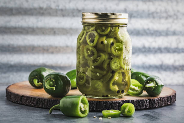 istock Quick Pickled Jalapeno Peppers on a Cutting Board 1423158997