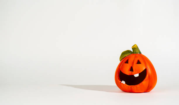 istock Funny pumpkin figure on a light background. 1423159449