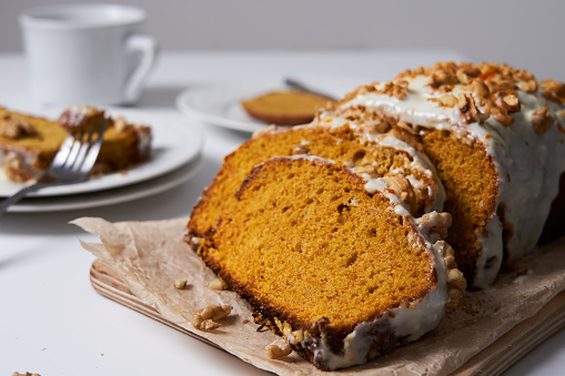 Slices of homemade carrot cake with sugar frosting and nuts. Food concept. Vegan Food